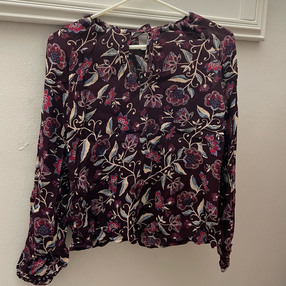 This is wine red blouse with floral designs on top by Forever 21. Size small